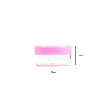 Kleine Kosmetikdose aus Kunststoff mit rosa Deckel